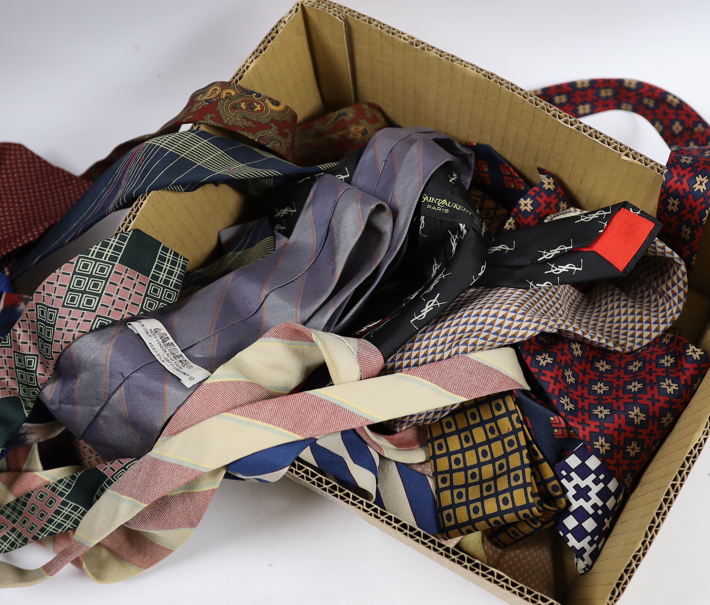 A collection of vintage and later silk ties, some designer including Jaeger, Pierre Cardin, Yves Saint Laurent and Balmain